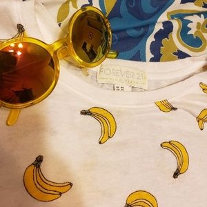 Banana shirt and round yellow sunglasses